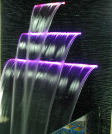 A row of 3 cascading waterfall effect with strips of LED light embedded at the openings to give colour to the waterfall (purple in photo).